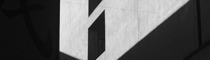 Geometric shadows cast on a textured wall